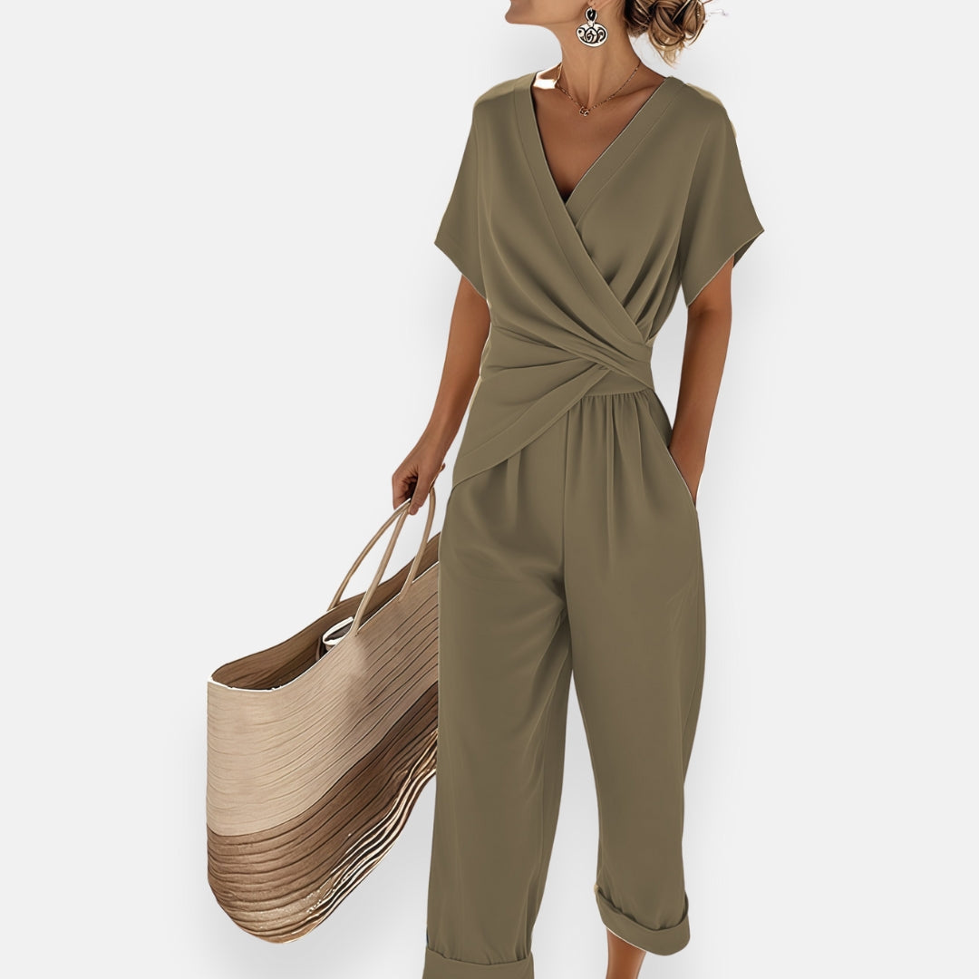 Damsommarjumpsuit draperad med rosett och vida ben
